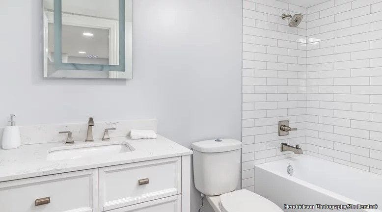 A Design Expert Explains How To Add Warmth To Your All-White Bathroom - House Digest
