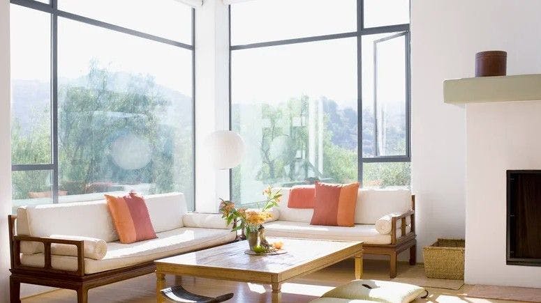 An Interior Design Expert Explains How To Style Your Windows To Make Them Look Bigger - House Digest
